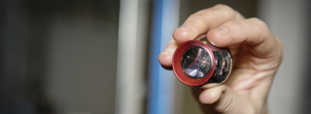 sphere for laser measurements held by a hand