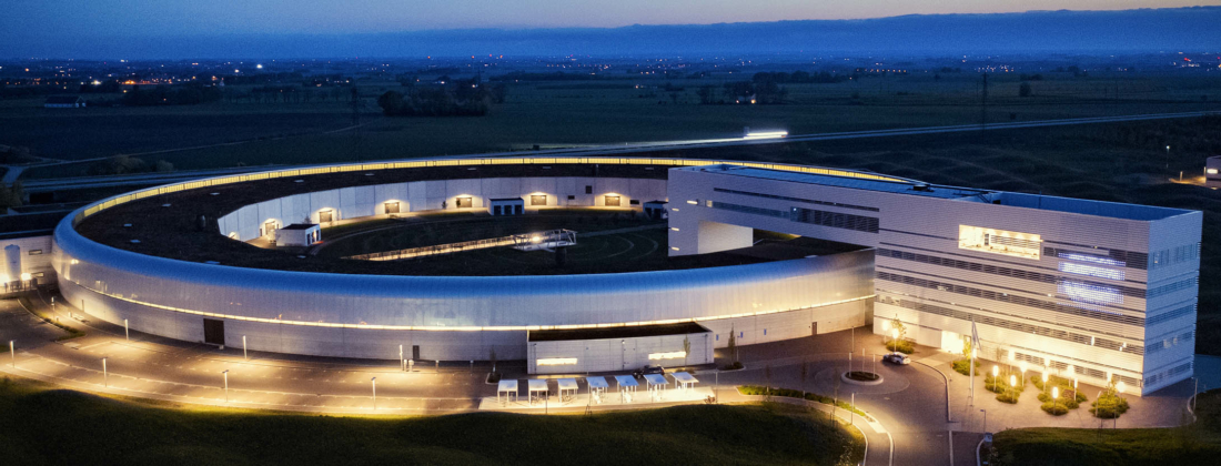 Dron image of the exterior of MAX IV at night.