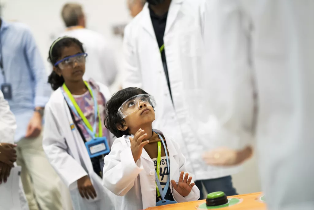 Children try the mini-ForMAX experiment.